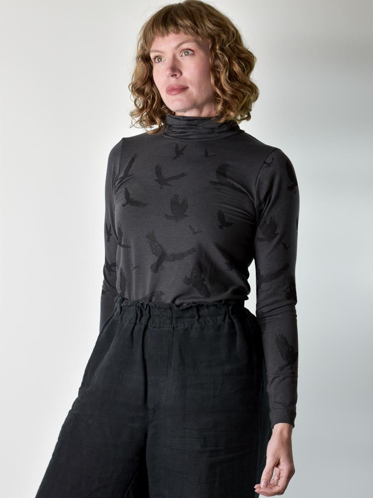 
                  
                    Crow Turtleneck poison-pear
                  
                