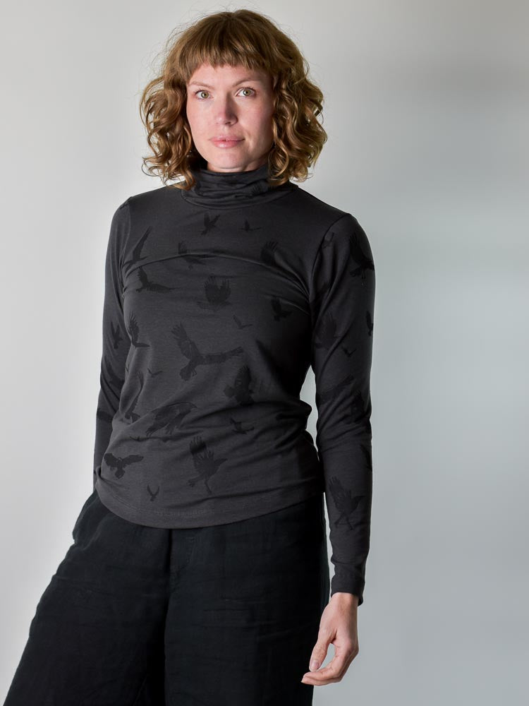 
                  
                    Crow Turtleneck poison-pear
                  
                